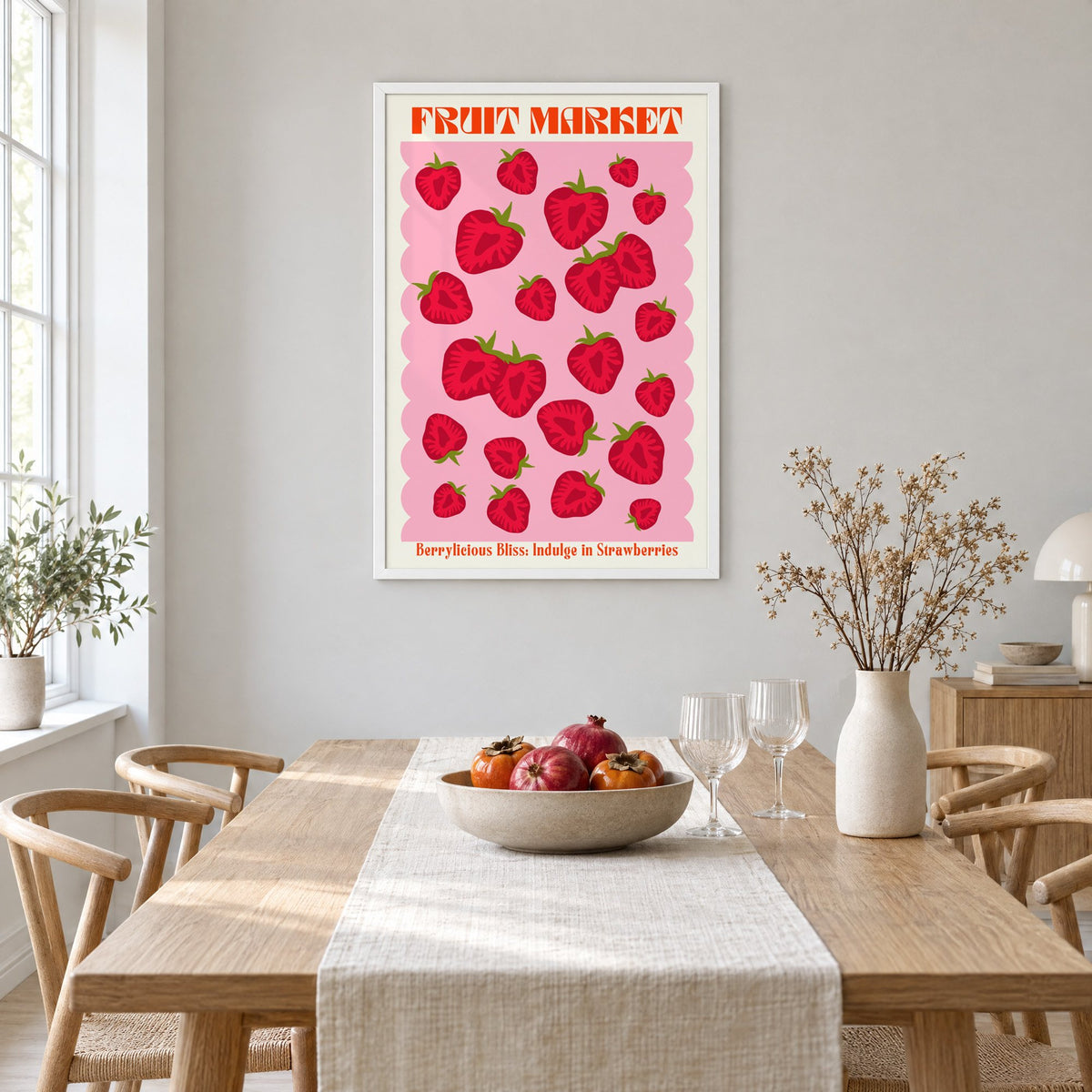 FRUIT MARKET strawberries pink scallop print in a white frame above a light oak dining table with a linen runner and fruit bowl