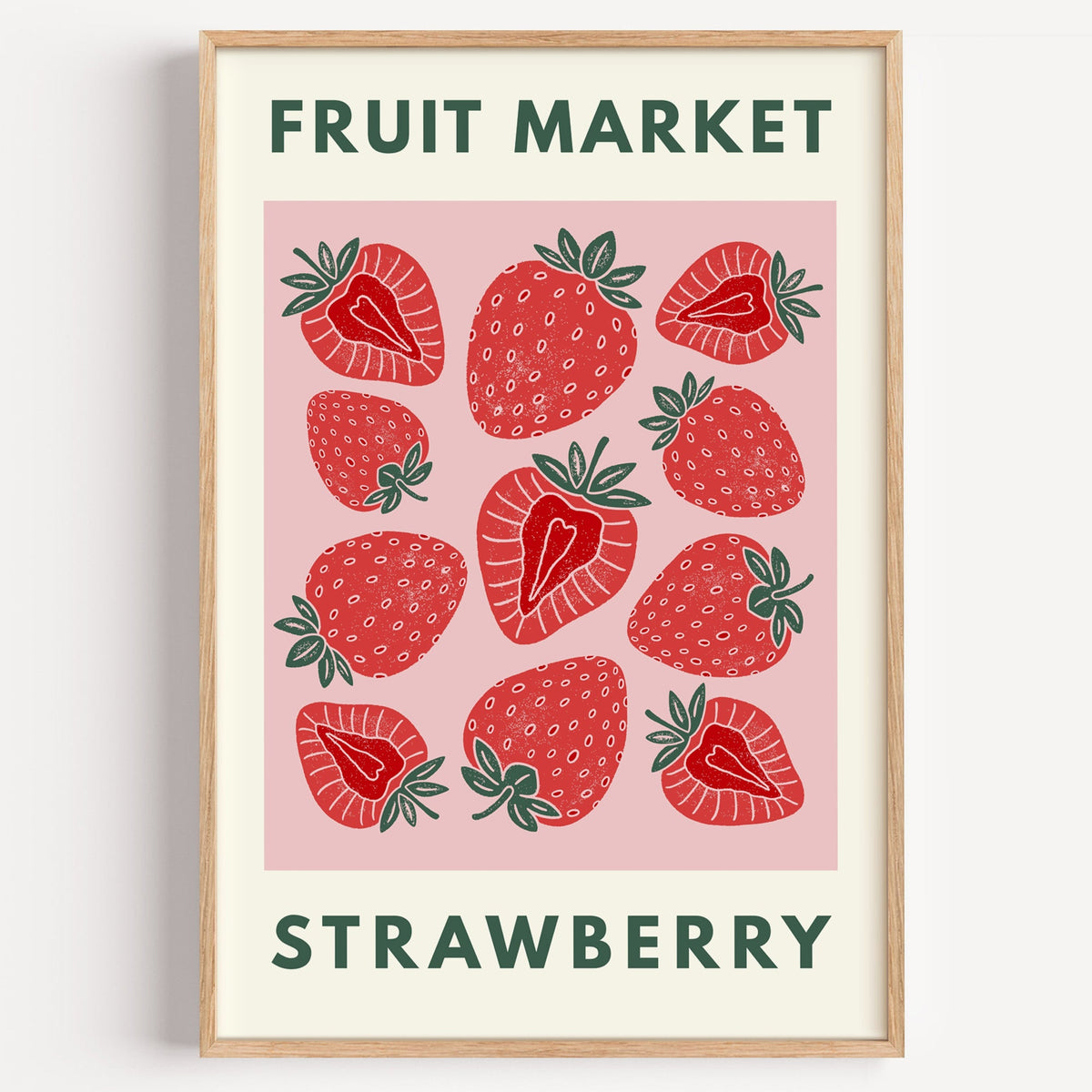 Fruit Market strawberry print in a light oak frame on a plain white wall