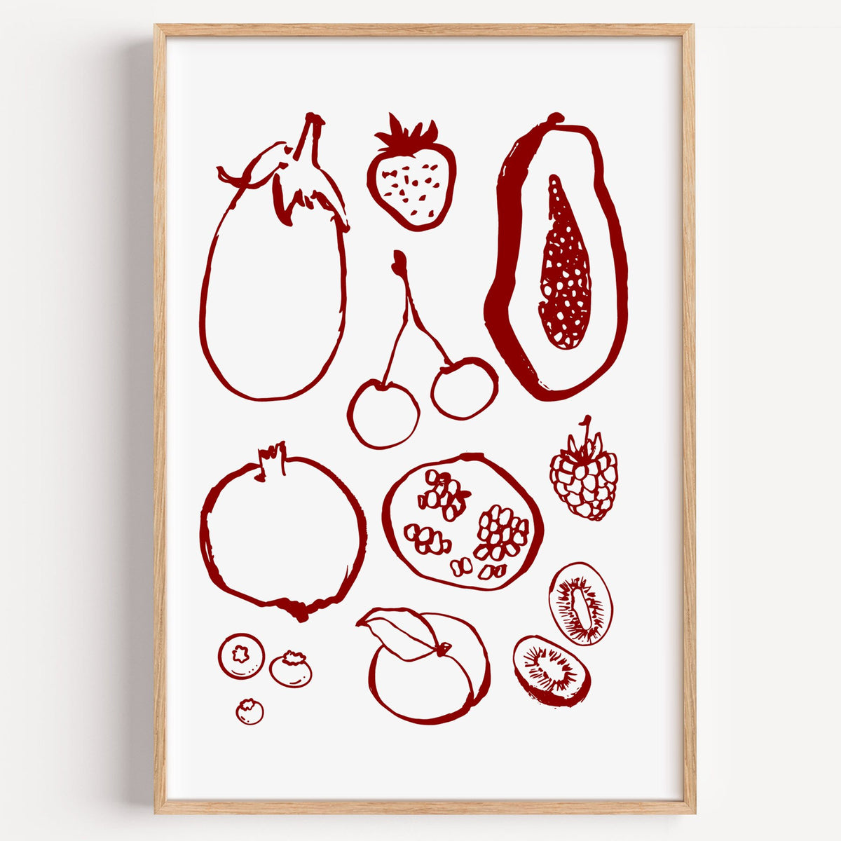 Burgundy ink fruit sketch pattern print in a light oak frame on a plain white wall