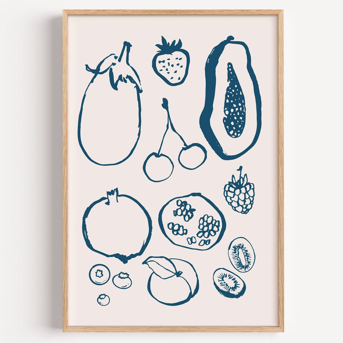 petrol blue ink fruit sketch pattern print in a light oak frame on a plain white wall