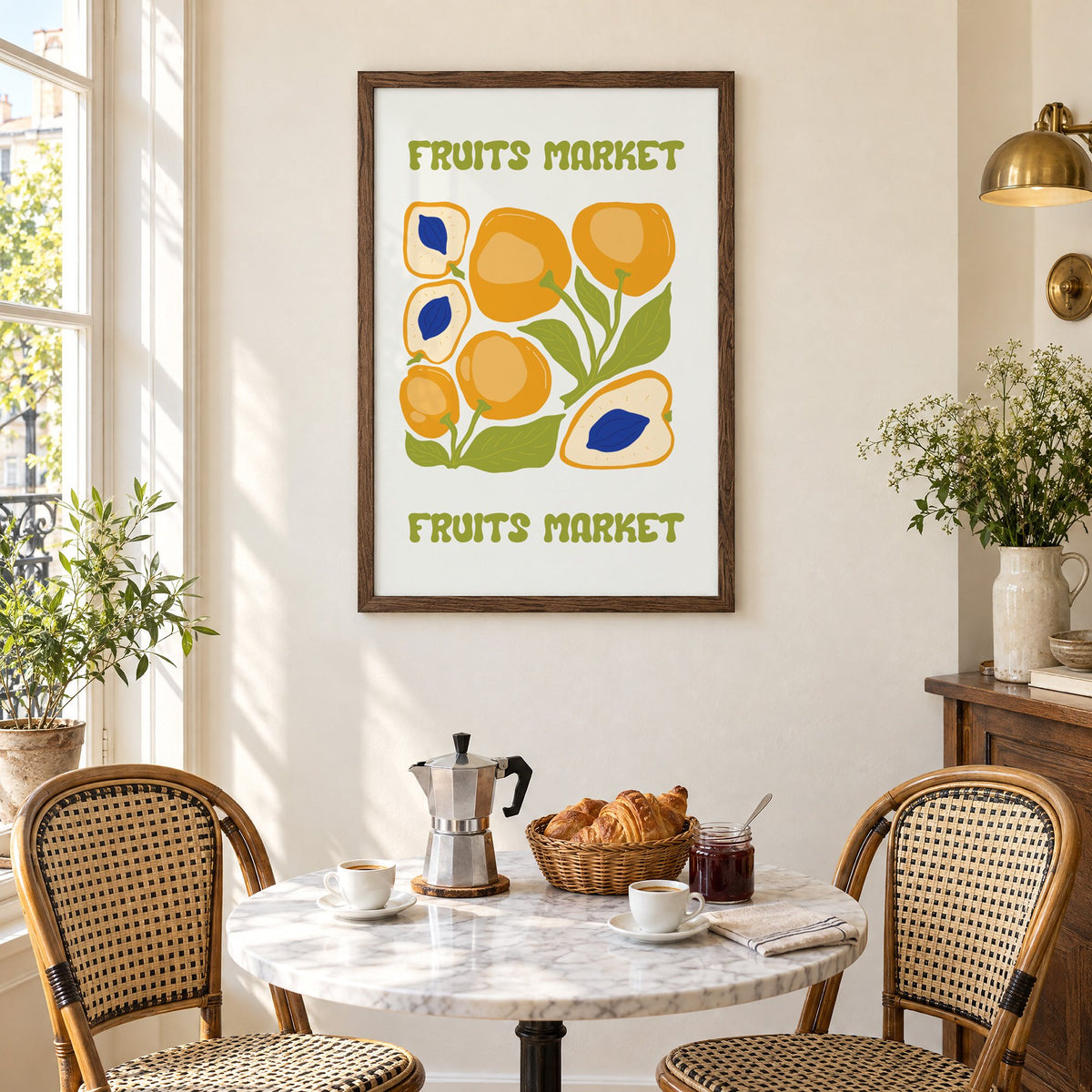 FRUITS MARKET apricots cobalt pits print in a walnut frame above a marble bistro table with croissants and rattan chairs