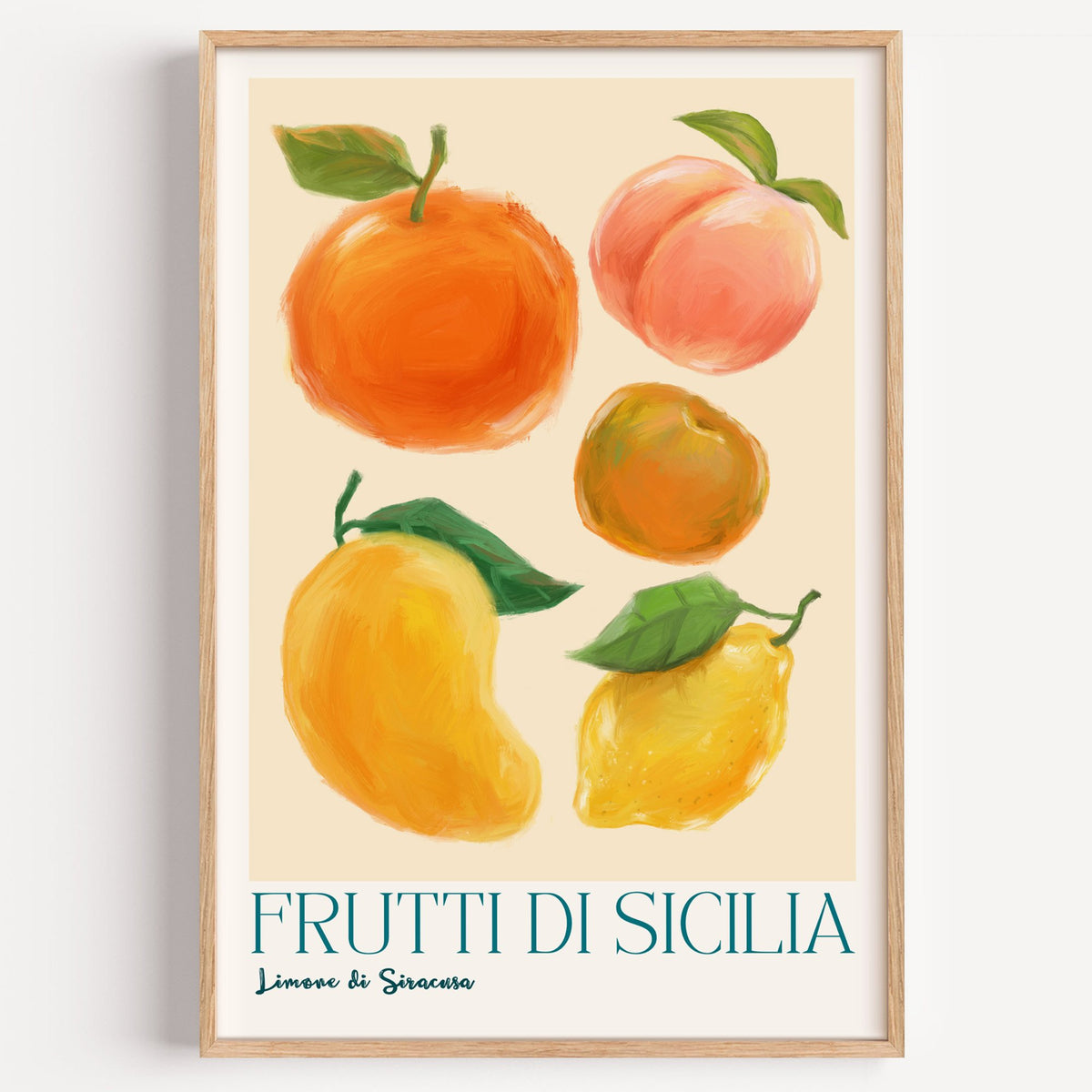 Frutti di Sicilia cream painted fruit print in a light oak frame on a plain white wall