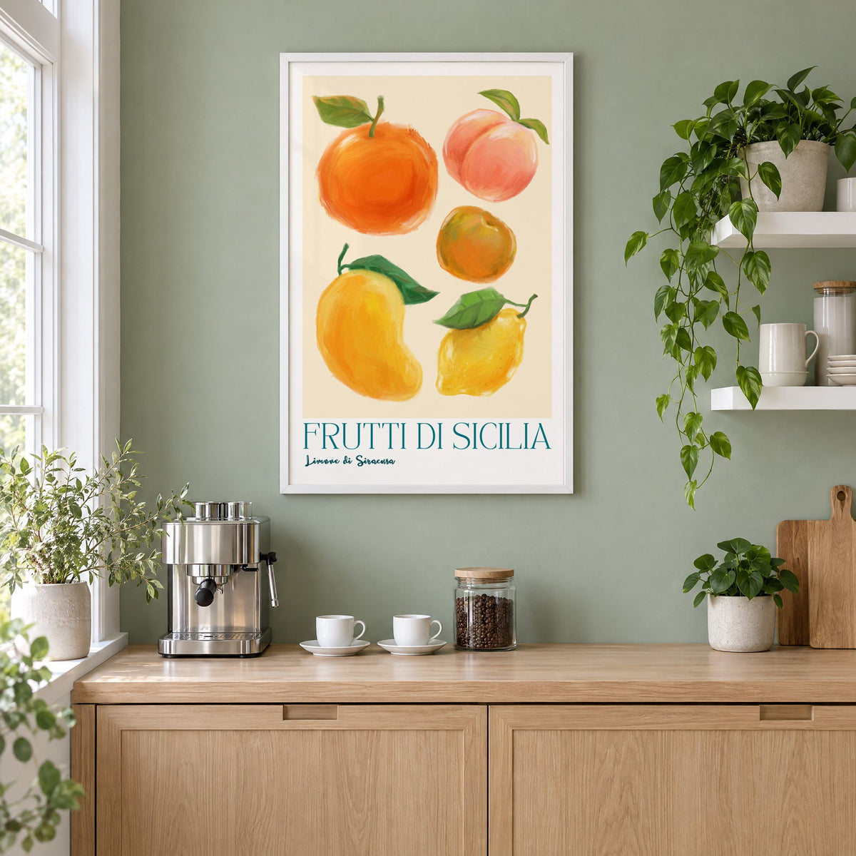 Frutti di Sicilia cream painted fruit print in a white frame on a sage green coffee nook wall above an espresso machine