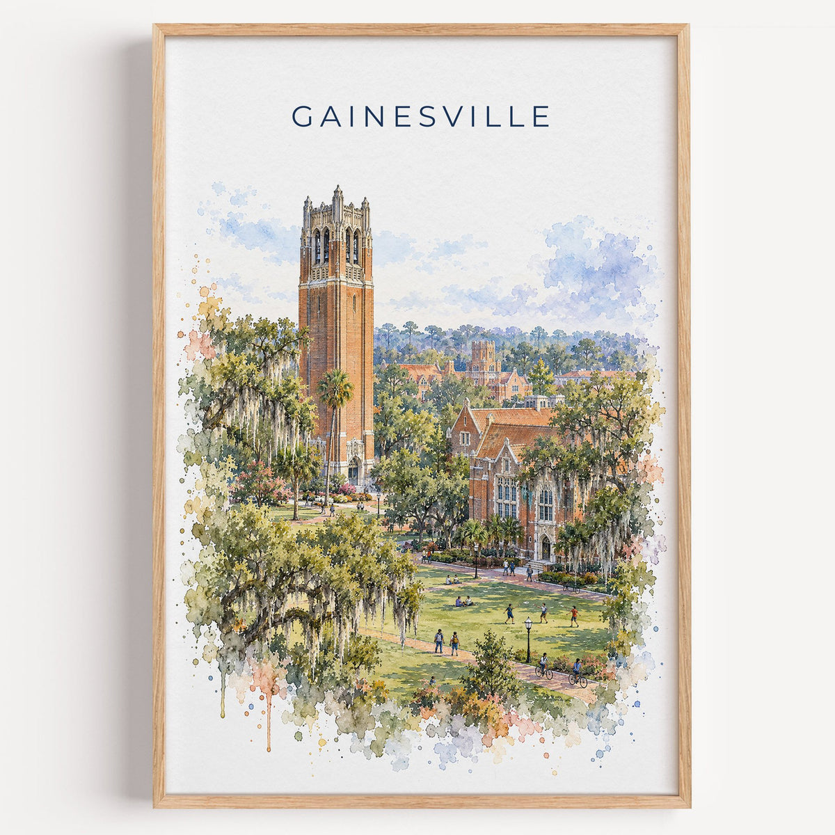 Gainesville, Florida watercolor print in a light oak frame on a plain white wall