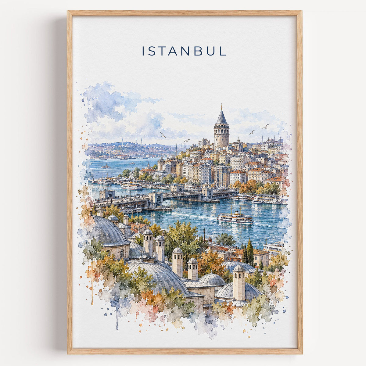 Galata Tower watercolor print in a light oak frame on a plain white wall