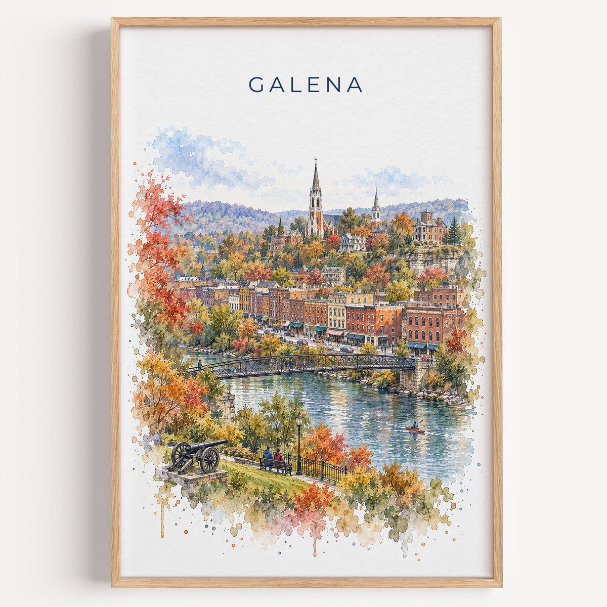 Galena, Illinois watercolor print in a light oak frame on a plain white wall