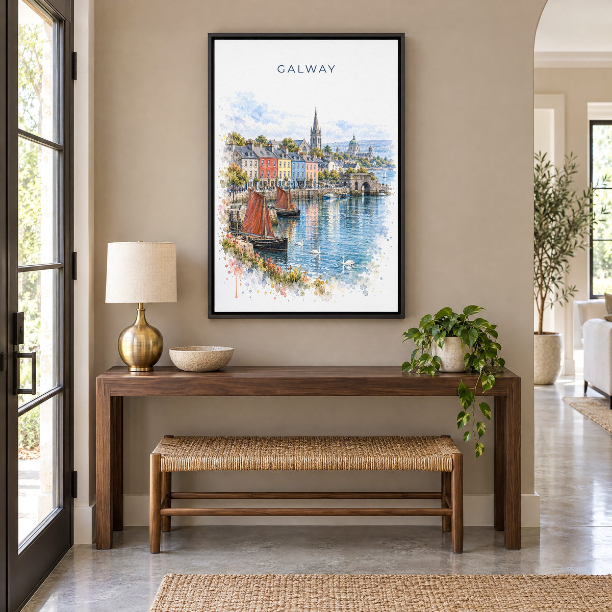 Galway watercolor print as a black floater canvas above a walnut console and woven bench in an entryway