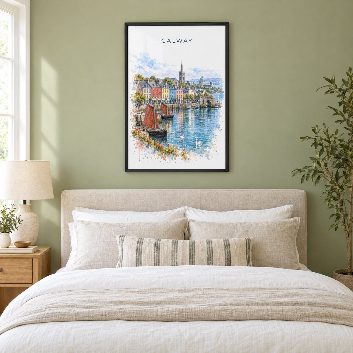 Galway watercolor print in a black frame above an upholstered headboard in a sage green bedroom