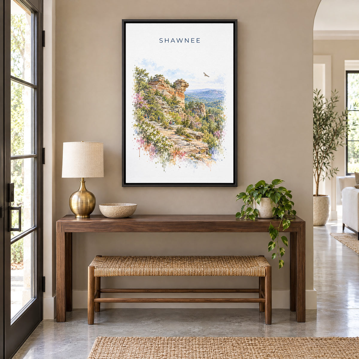Garden of the Gods, Illinois watercolor print as a black floater canvas above a walnut console and woven bench in an entryway