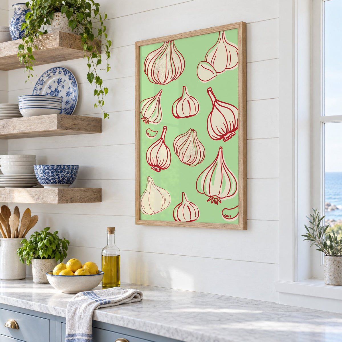 Garlic bulbs red line mint pattern in an oak frame in a white coastal kitchen beside blue and white plates