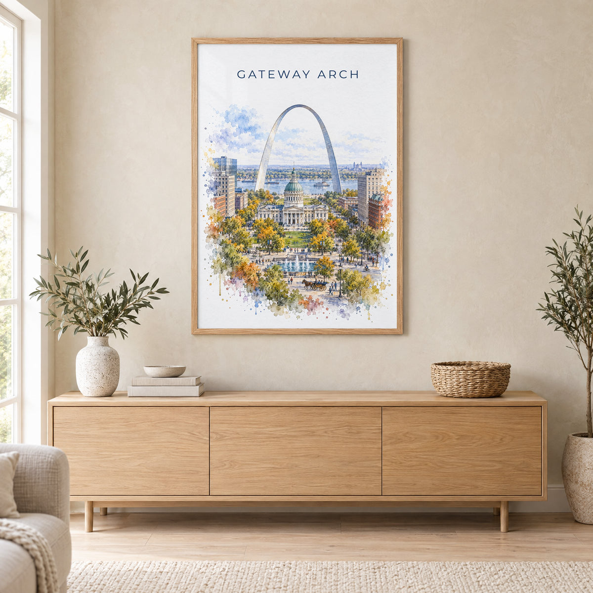 Gateway Arch National Park watercolor print in an oak frame above a light wood sideboard in a Scandinavian living room