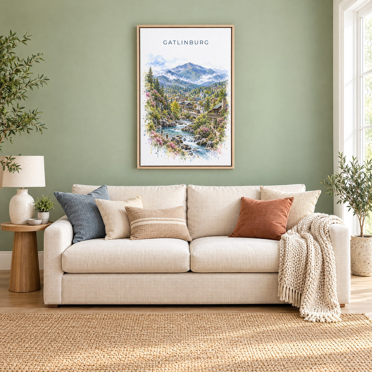 Gatlinburg watercolor print as a natural floater canvas above a cream linen sofa on a sage green wall