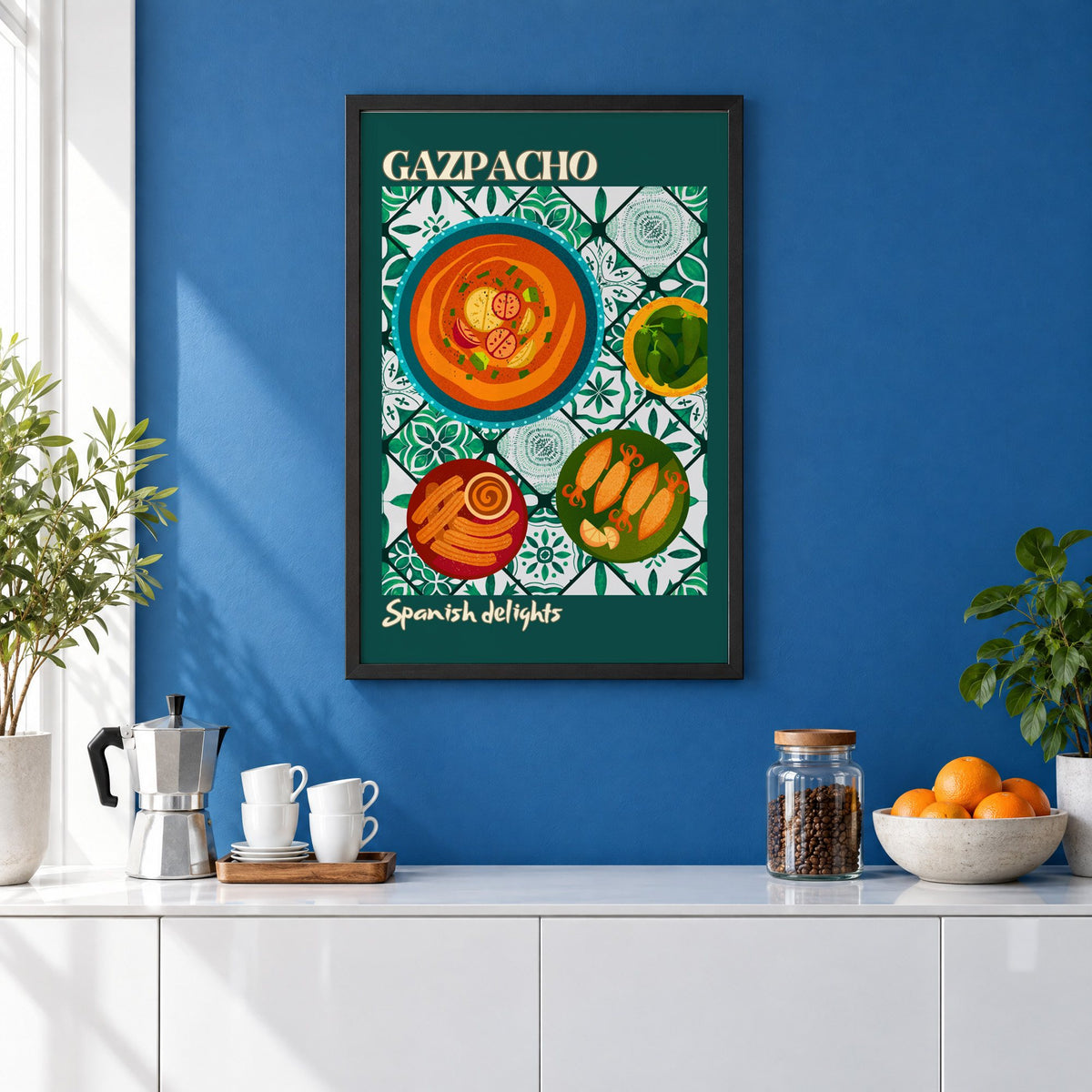 Gazpacho tapas print with teal border in a black frame on a cobalt blue wall above a coffee station