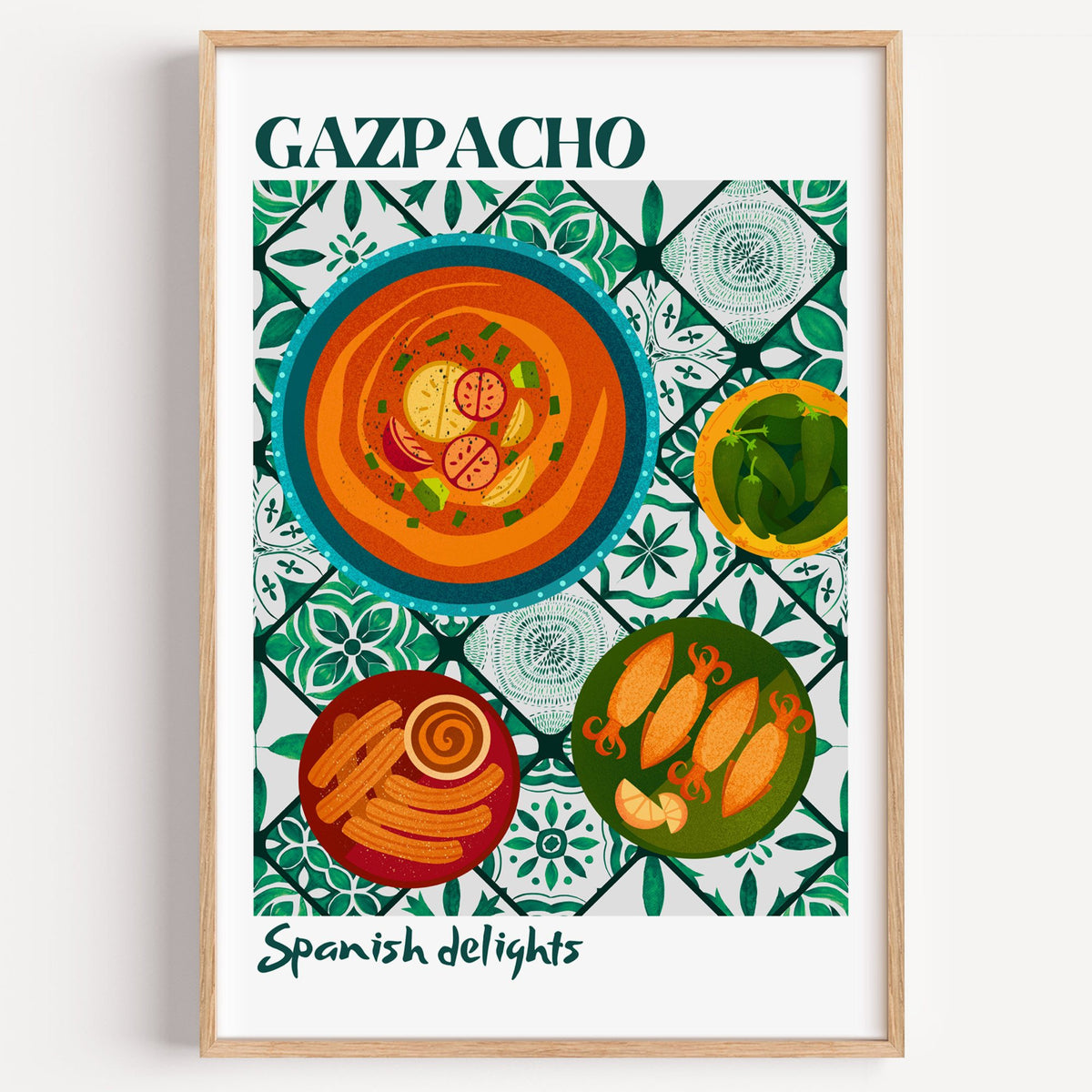 Gazpacho tapas print with white border in a light oak frame on a plain white wall