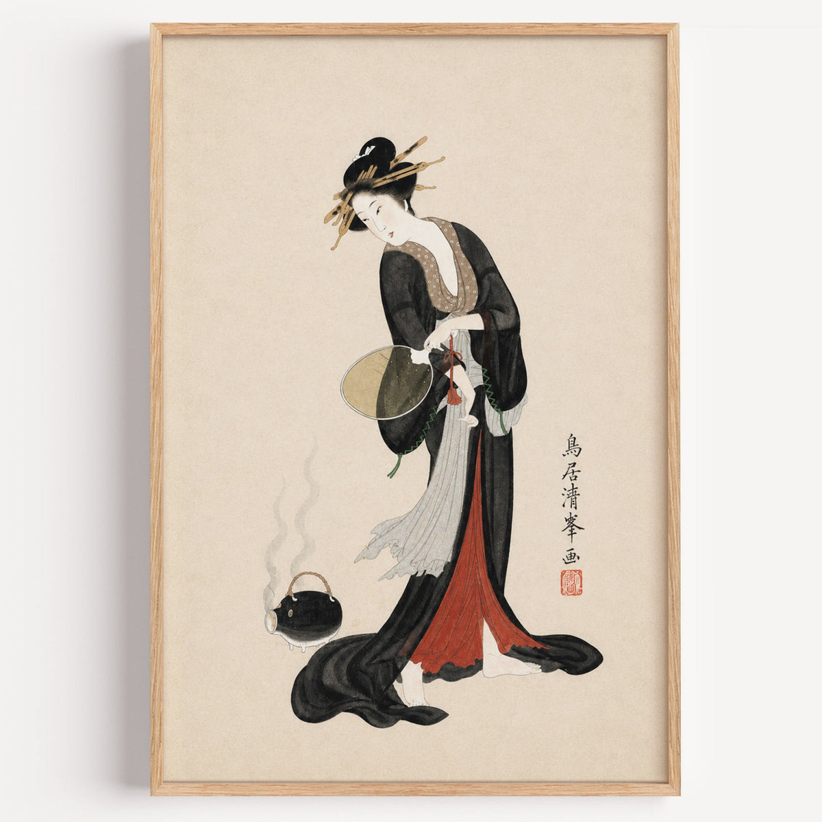 woman in black kimono with fan print in a light oak frame on a plain white wall