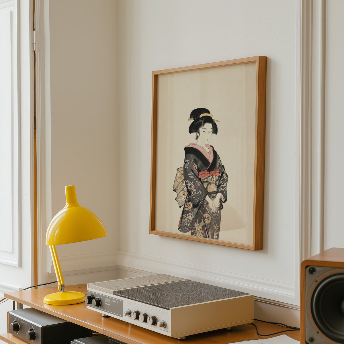woman in dark floral kimono print in an oak frame above a vintage hi-fi shelf with a yellow desk lamp