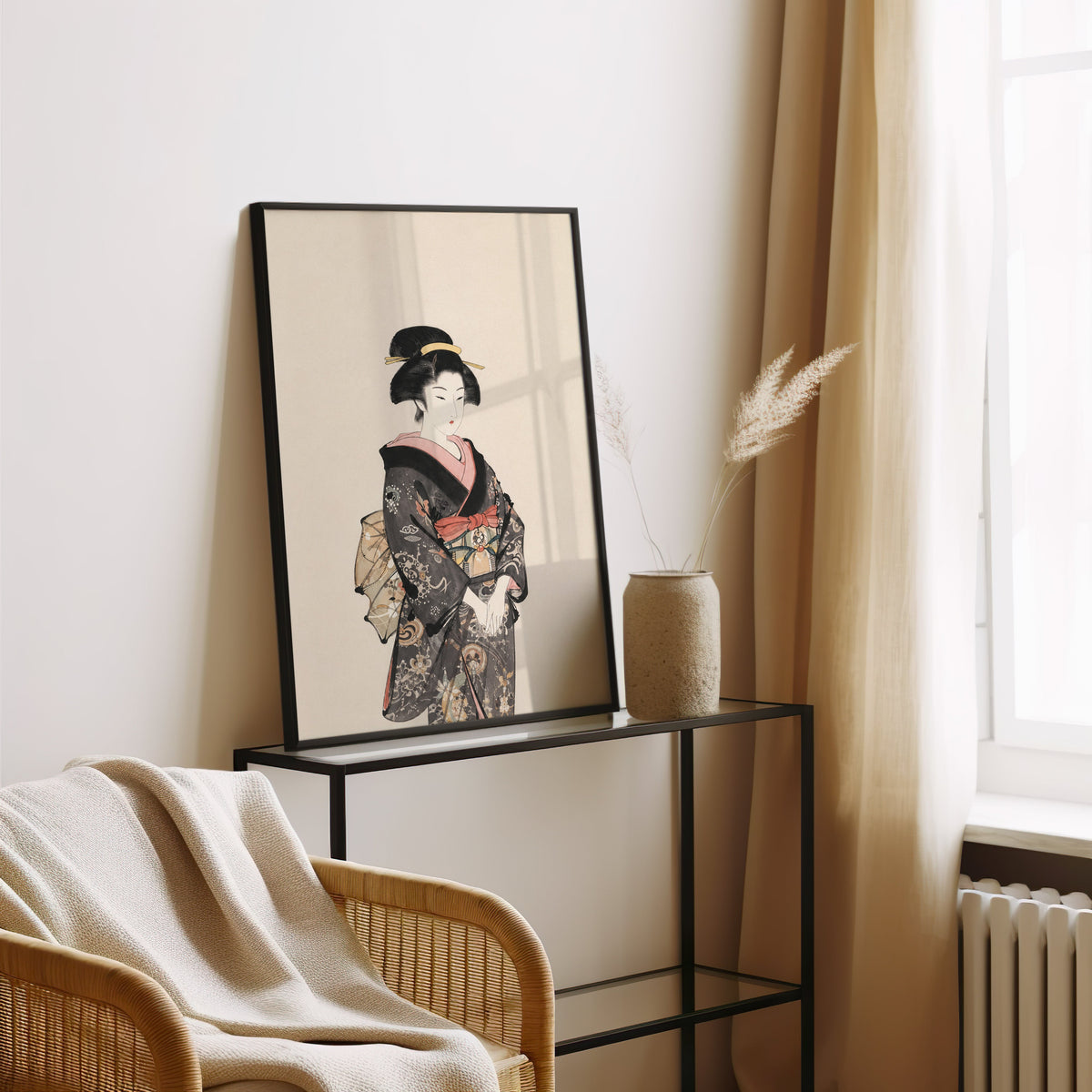 woman in dark floral kimono print in a black frame leaning on a glass console beside pampas grass
