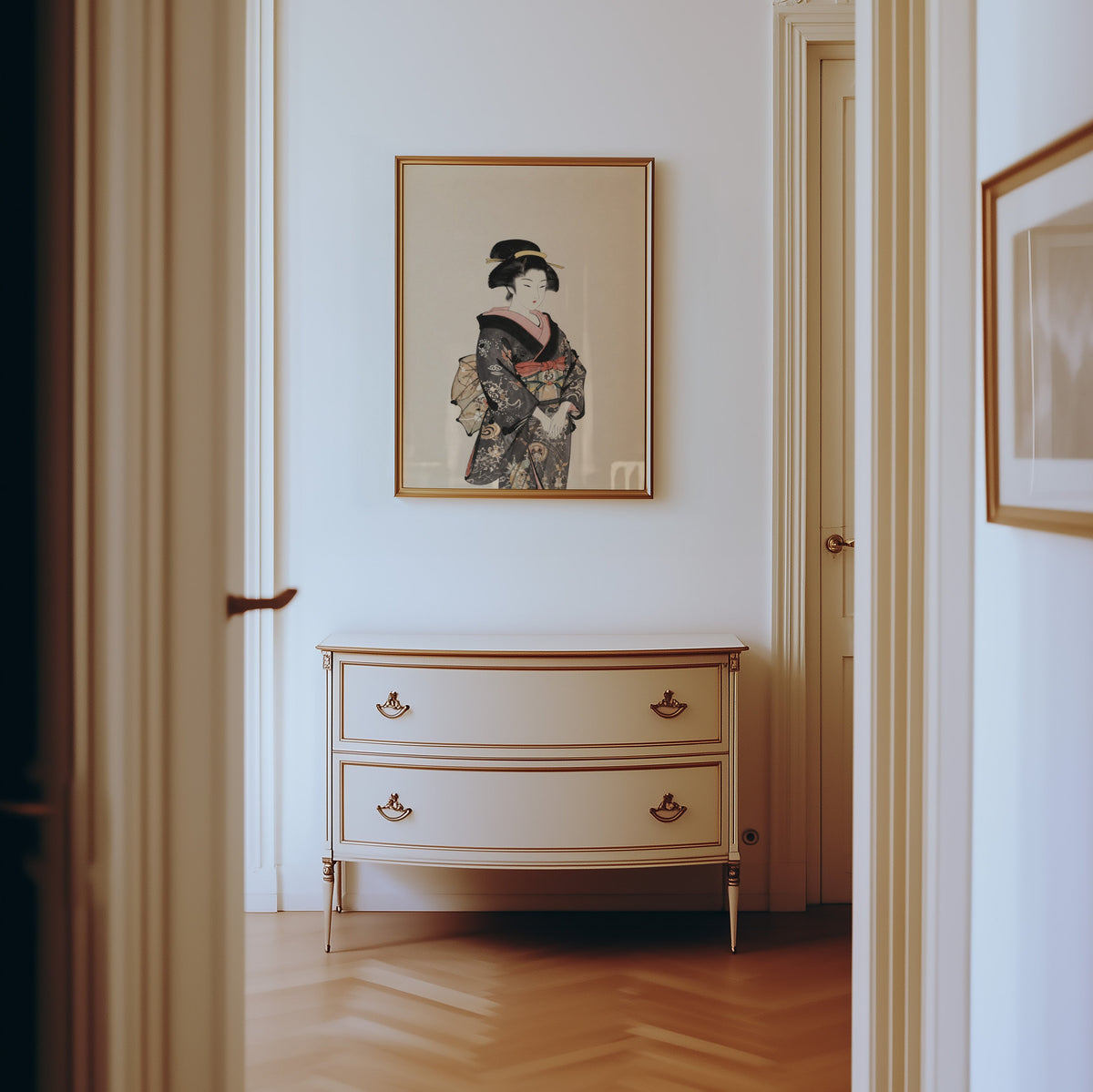 woman in dark floral kimono print shown in a gold frame in a hallway above a cream dresser