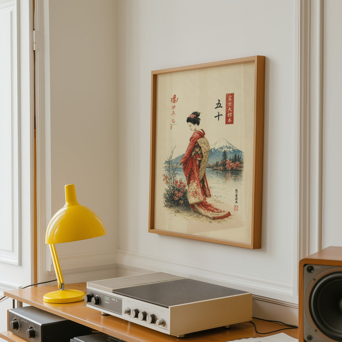 woman in red kimono by Mount Fuji print in an oak frame above a vintage hi-fi shelf with a yellow desk lamp