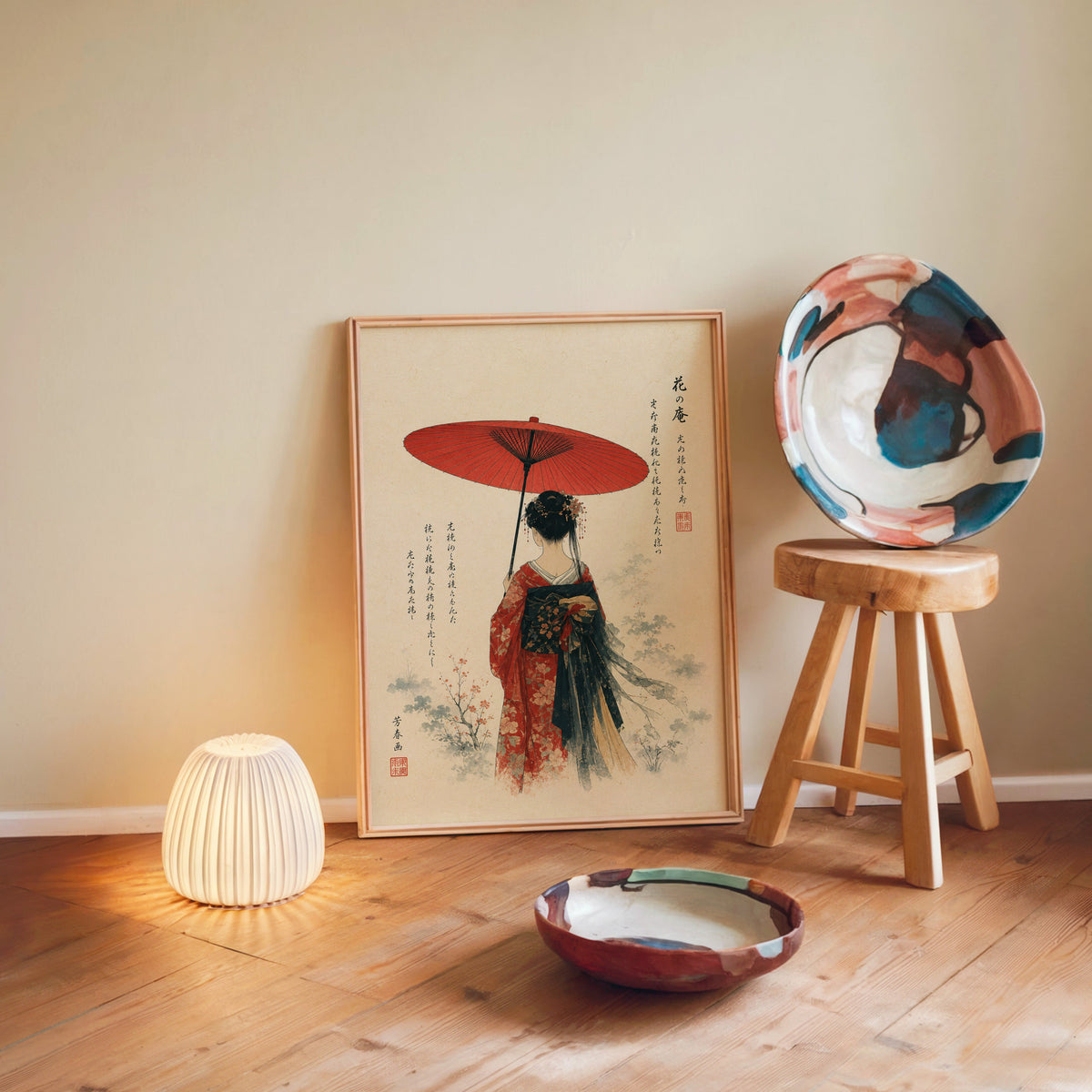woman with red paper parasol print in a light wood frame leaning on a wooden floor by a glowing lamp and stool