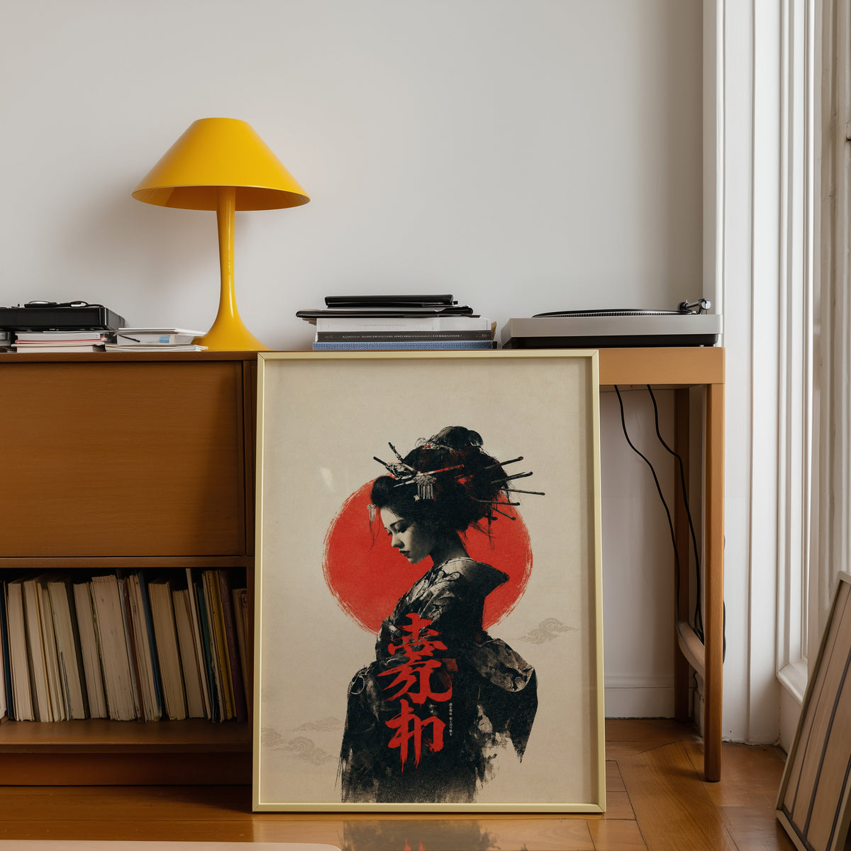 ink portrait of kimono woman with red sun print shown in a gold frame leaning under a teak desk with a yellow lamp