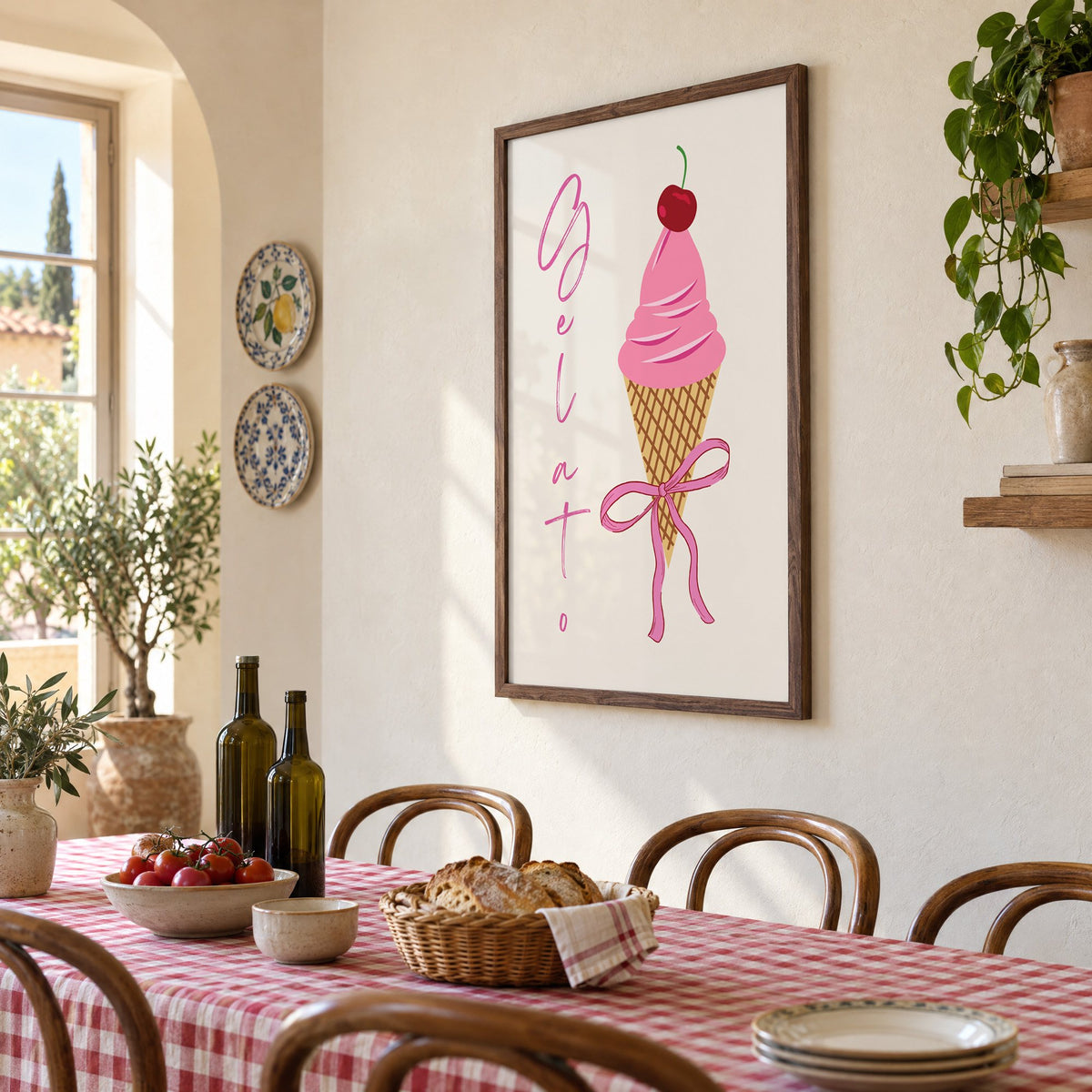 Gelato pink cone with bow print in a walnut frame above a gingham-covered trattoria table, seen at an angle