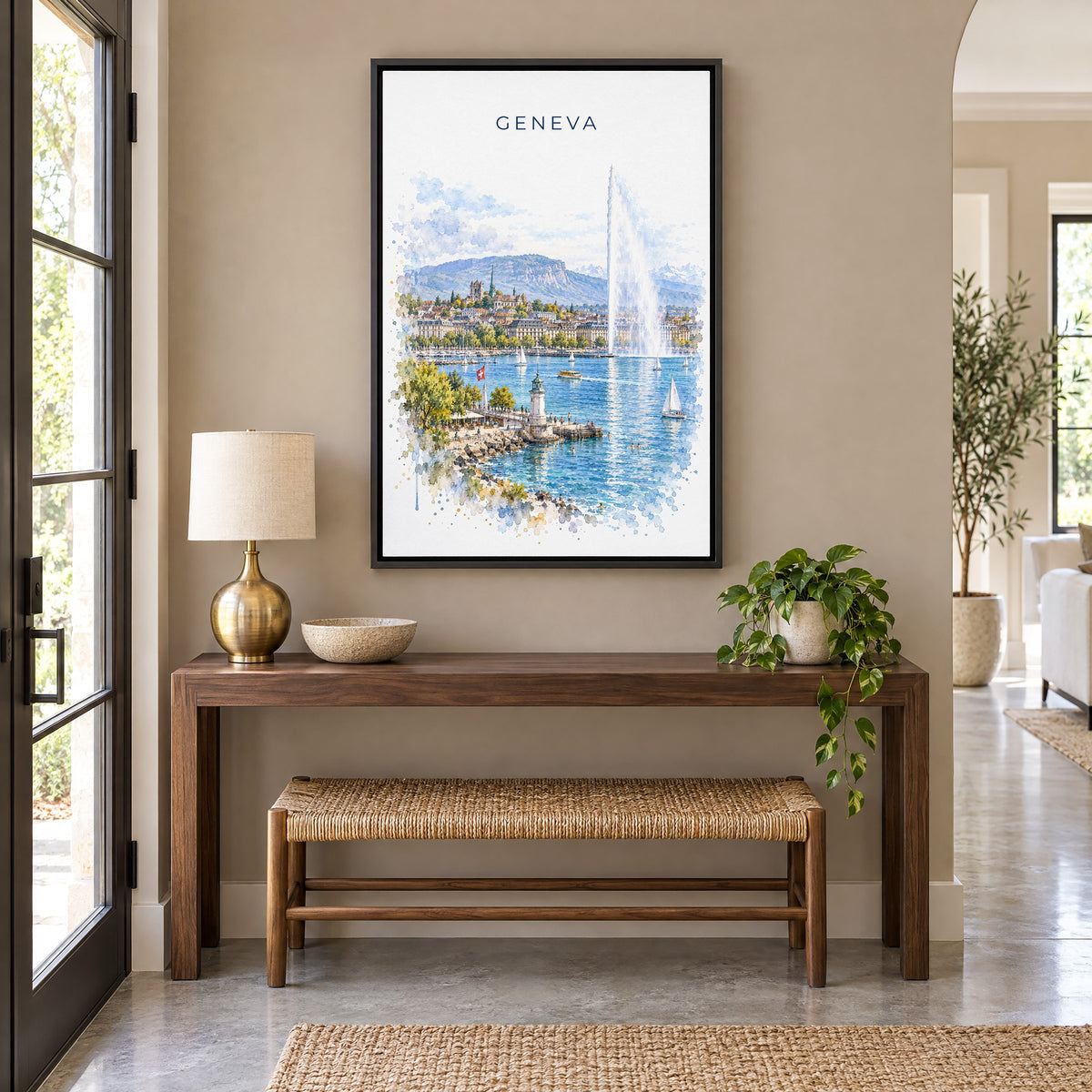 Geneva watercolor print as a black floater canvas above a walnut console and woven bench in an entryway