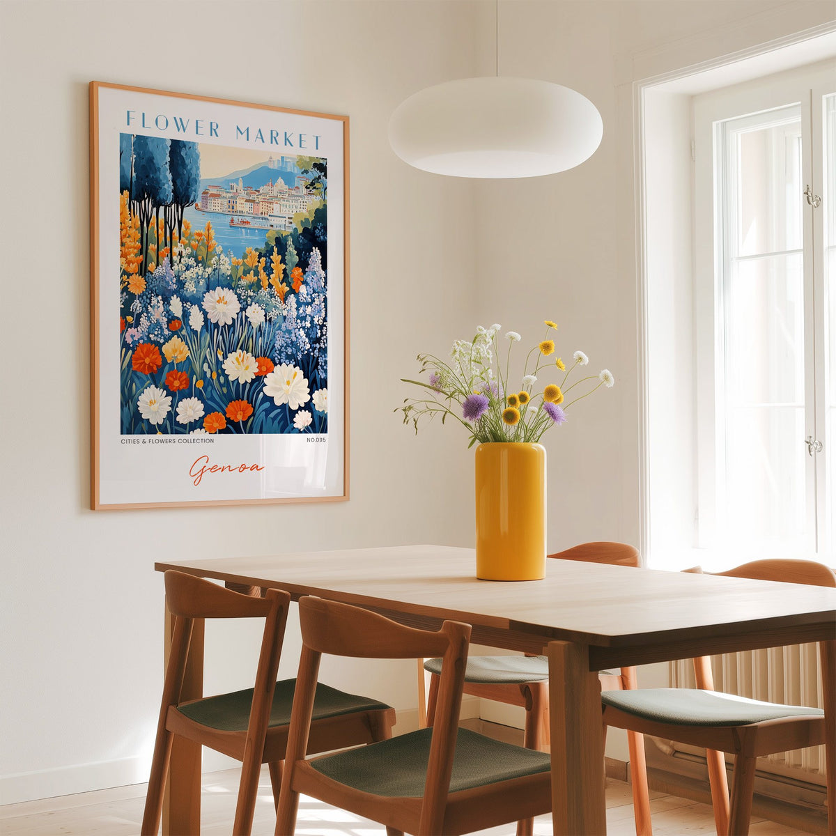 Genoa flower market print in an oak frame above a dining table with a yellow vase and white pendant light