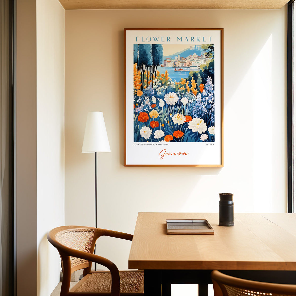Genoa flower market print in an oak frame above a dining table and cane chair