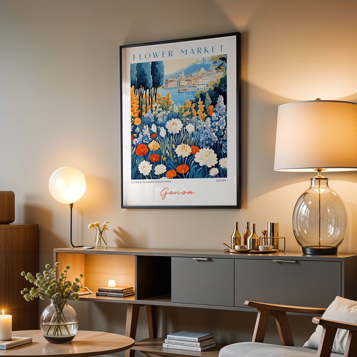 Genoa flower market print in a black frame above a grey media console with a glass table lamp