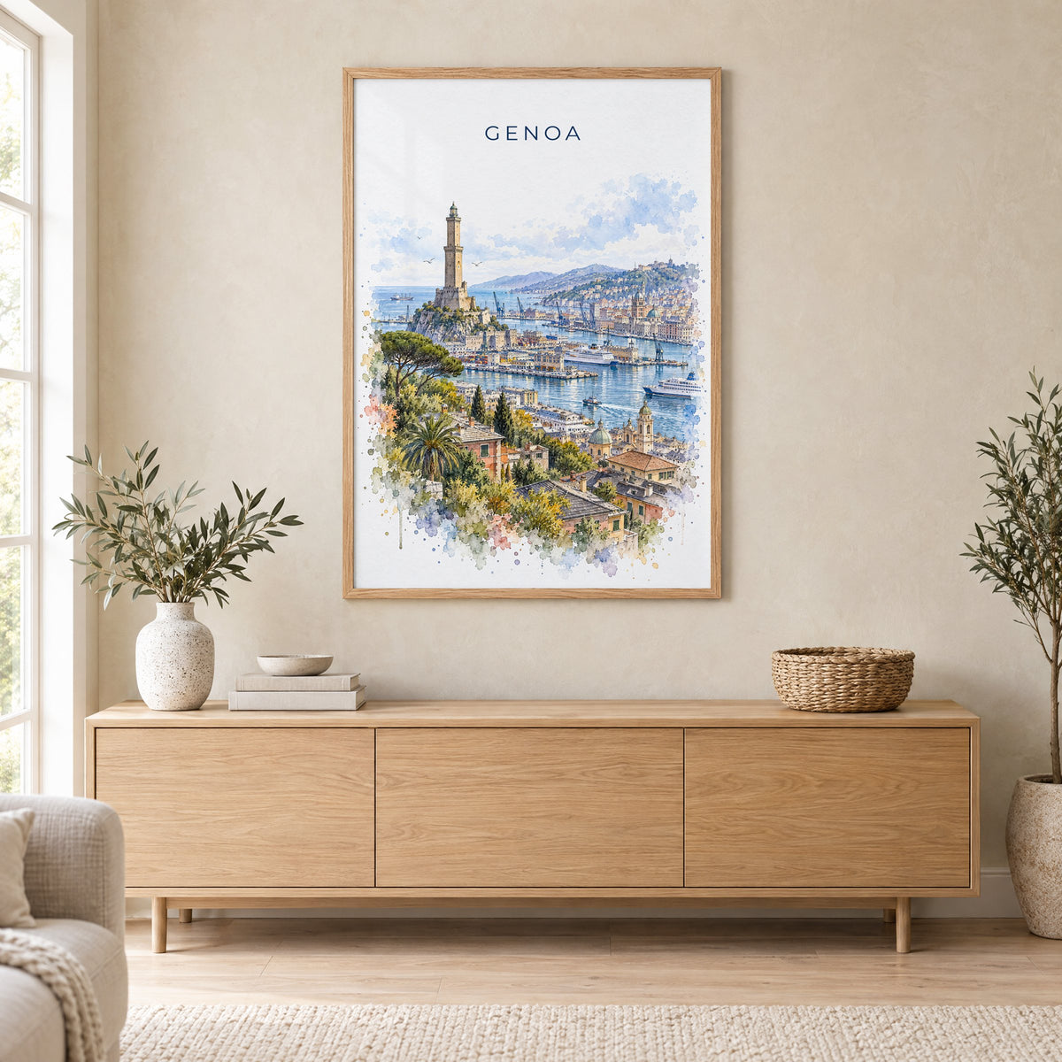 Genoa watercolor print in an oak frame above a light wood sideboard in a Scandinavian living room