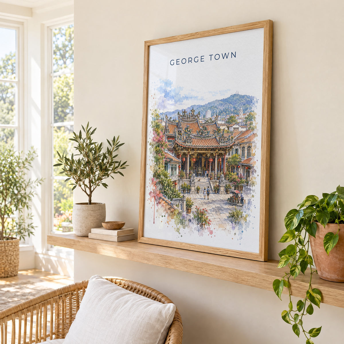 George Town, Malaysia watercolor print in an oak frame on a picture ledge in a sunlit sunroom