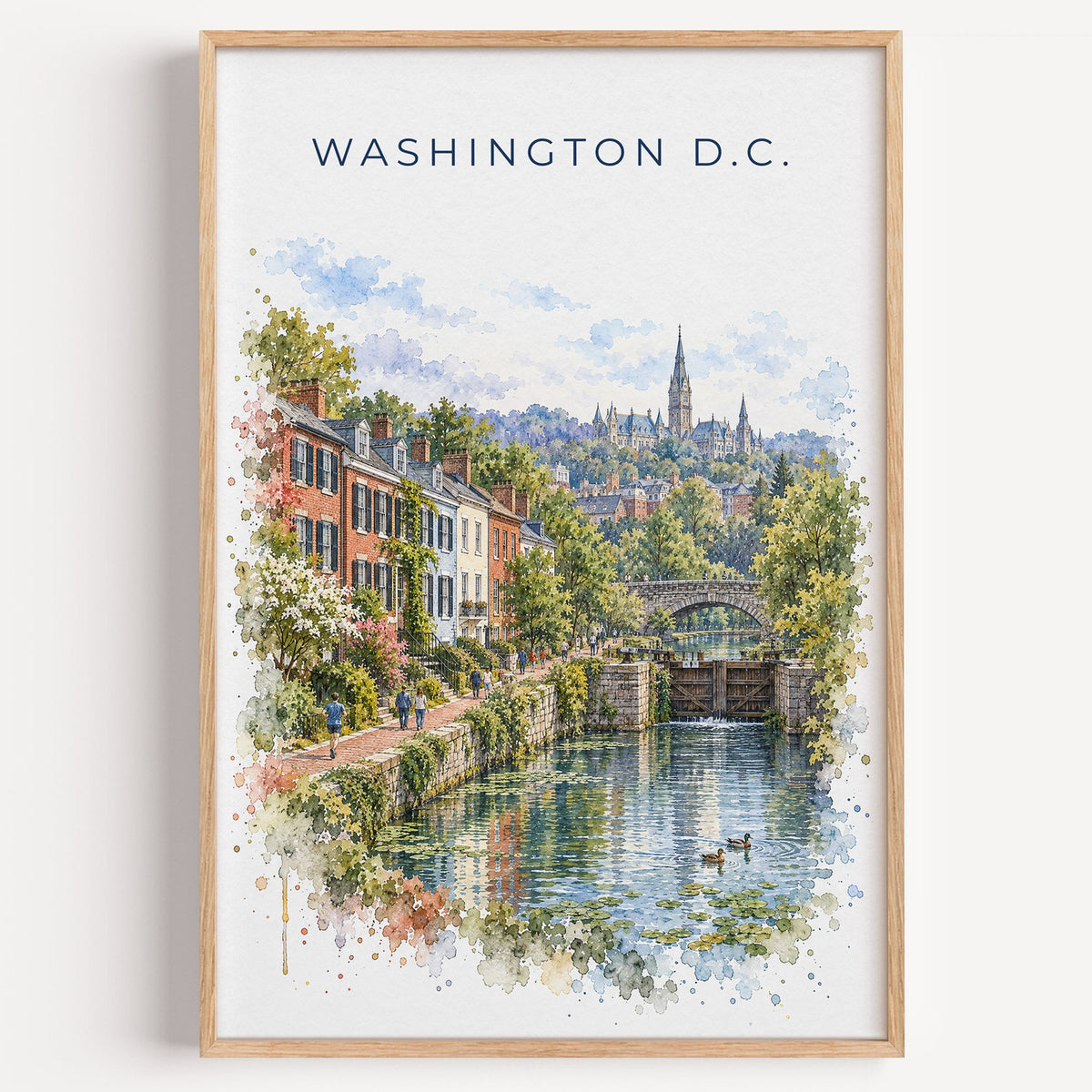 Georgetown DC watercolor print in a light oak frame on a plain white wall