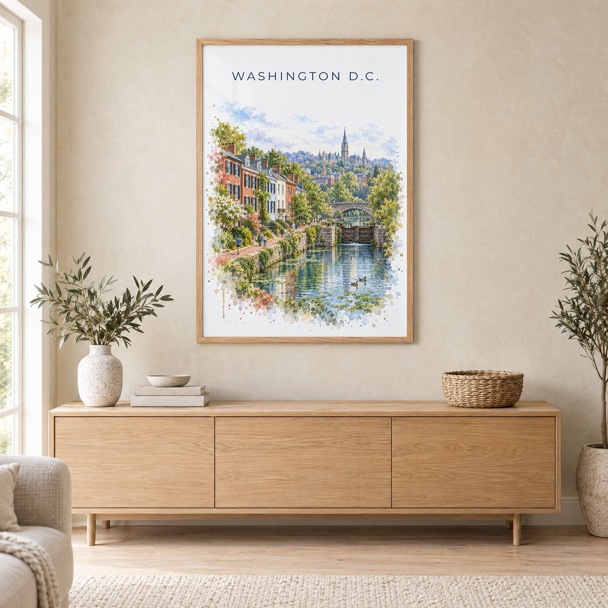 Georgetown DC watercolor print in an oak frame above a light wood sideboard in a Scandinavian living room