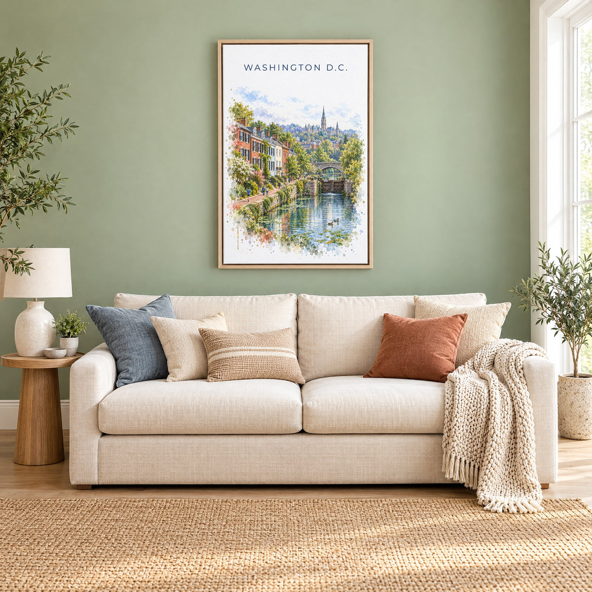 Georgetown DC watercolor print as a natural floater canvas above a cream linen sofa on a sage green wall