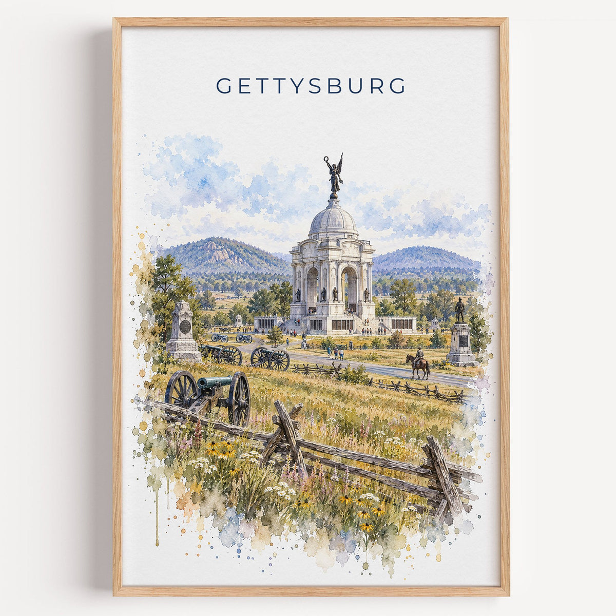 Gettysburg watercolor print in a light oak frame on a plain white wall