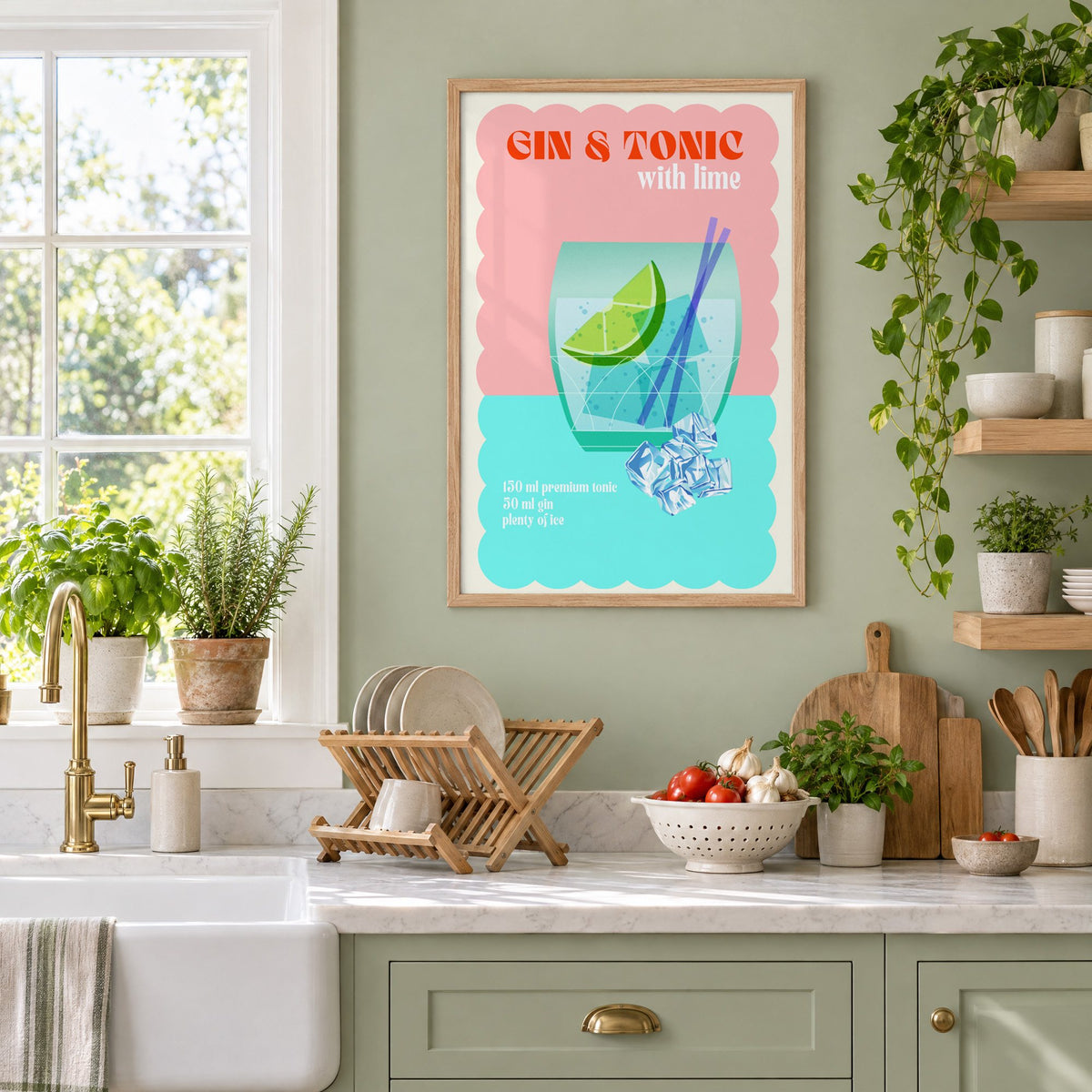 Gin & Tonic with lime aqua print in an oak frame on a sage green kitchen wall beside a farmhouse sink and herbs