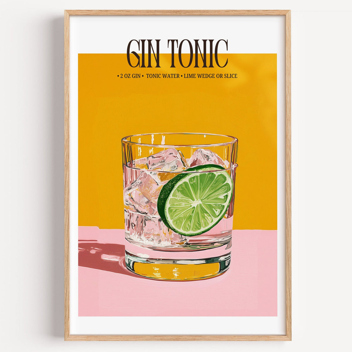 Gin and tonic recipe print in a light oak frame on a plain white wall