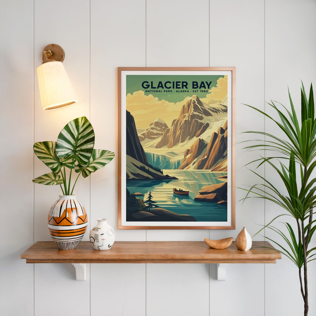 Glacier Bay National Park print in a copper frame above an oak shelf on white shiplap