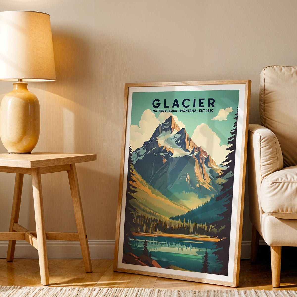 Glacier print in an oak frame beside a cream armchair and an amber lamp in warm afternoon light