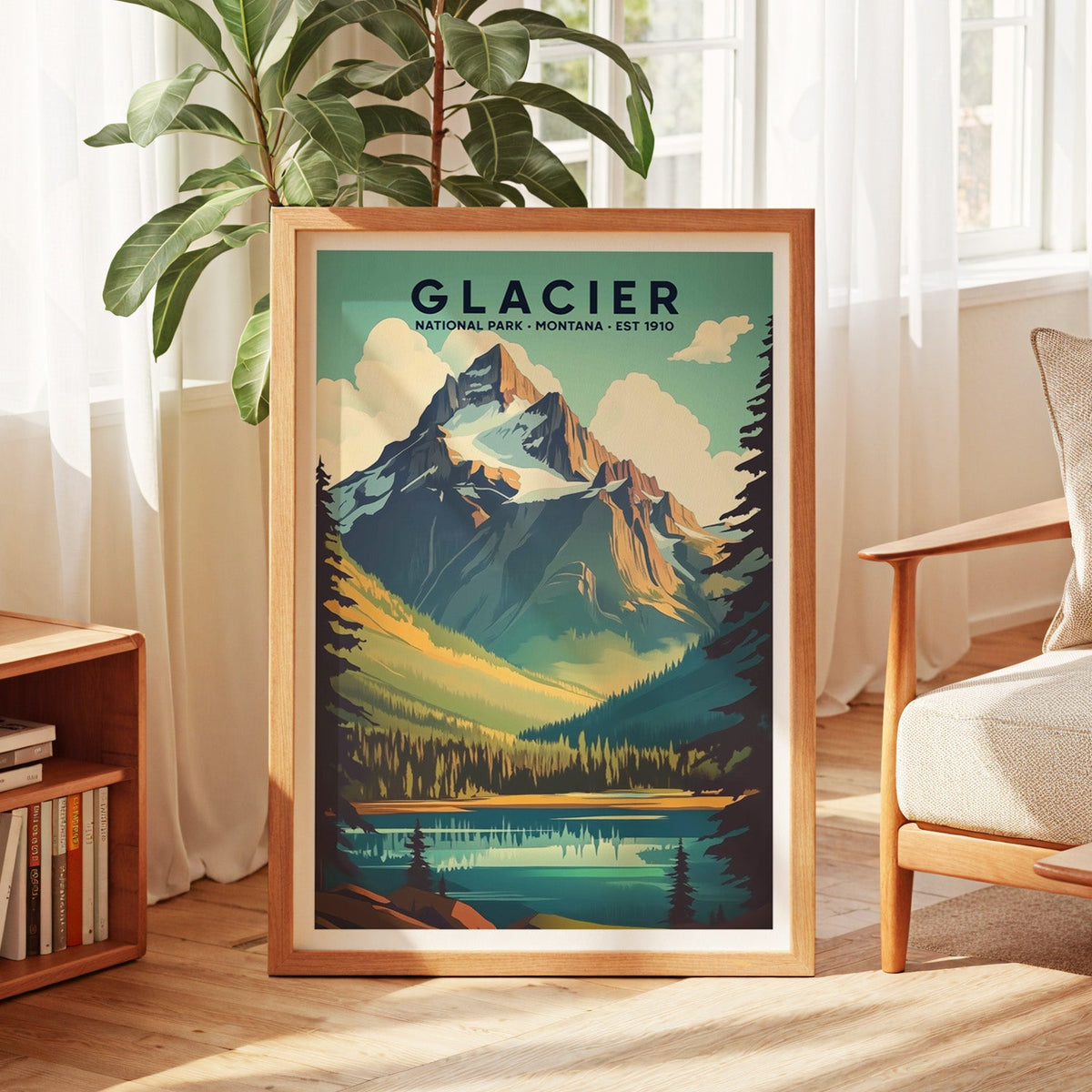 Glacier National Park print in an oak frame by a sunlit window with sheer curtains and a fig plant