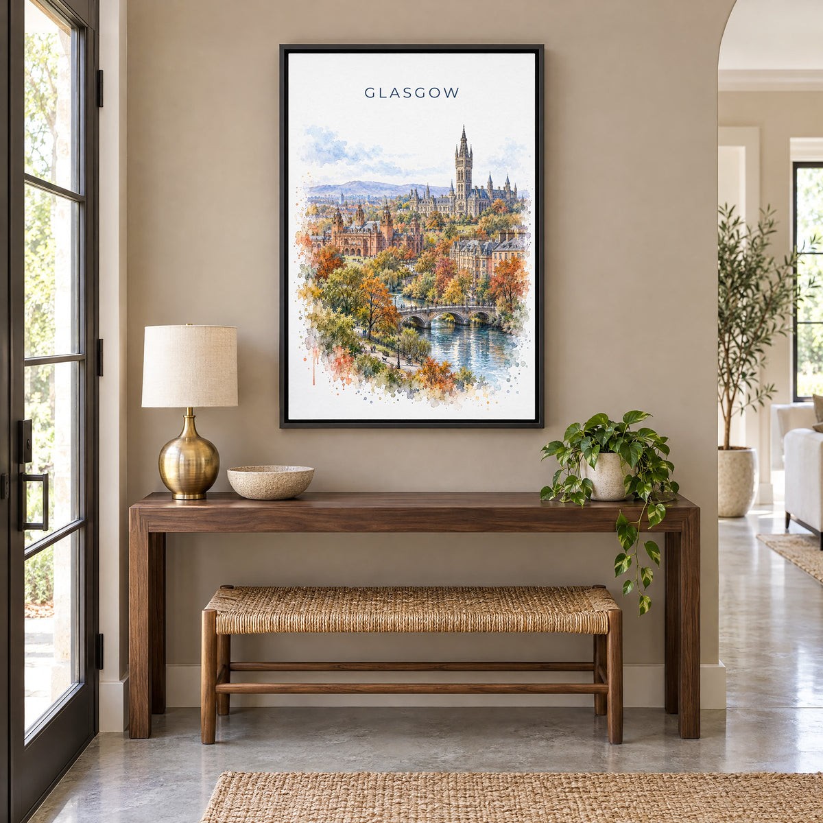 Glasgow watercolor print as a black floater canvas above a walnut console and woven bench in an entryway