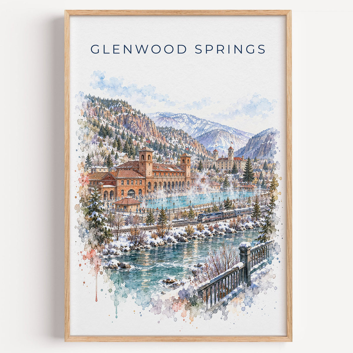 Glenwood Springs watercolor print in a light oak frame on a plain white wall
