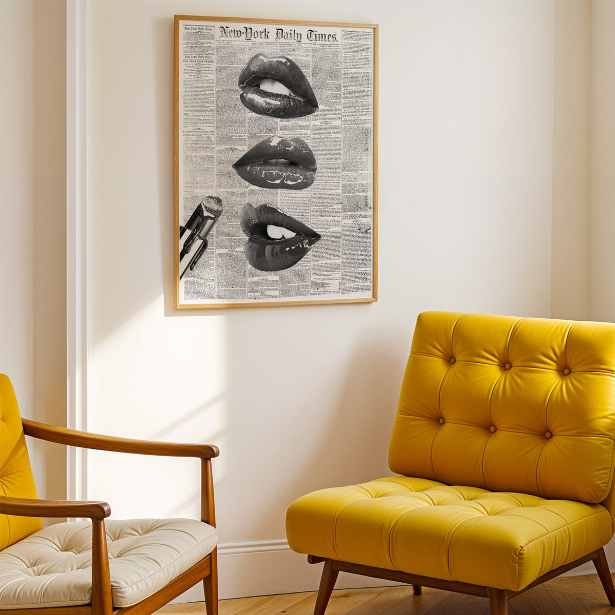 Glossy lips and lipstick on 1851 newspaper page print shown in a gold frame above a mustard yellow tufted armchair