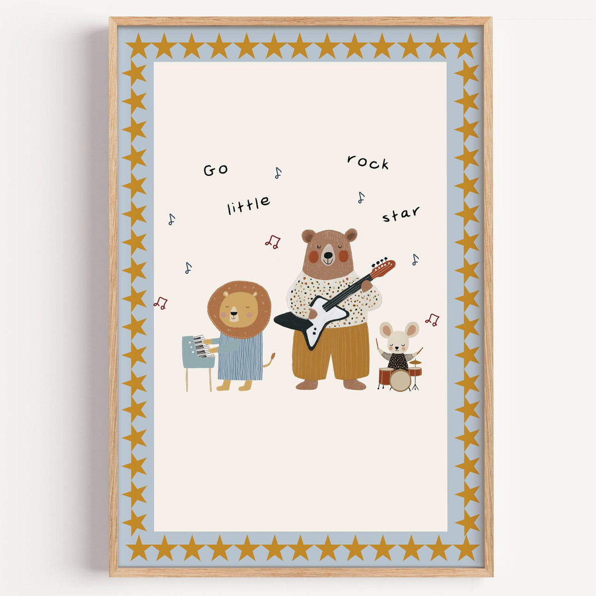 Go little rock star band nursery print in a light oak frame on a plain white wall