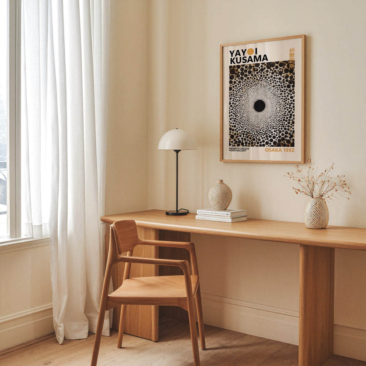 Yayoi Kusama inspired gold and black dot vortex print above a desk with a dome lamp