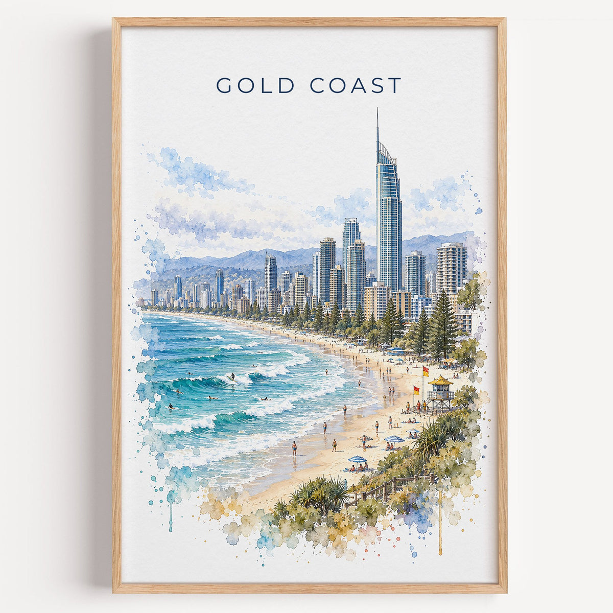 Gold Coast watercolor print in a light oak frame on a plain white wall