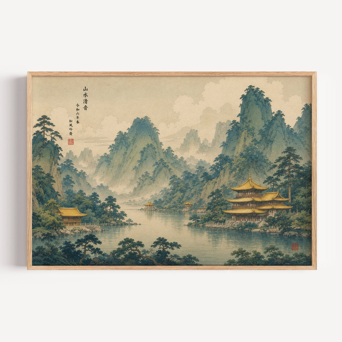Golden temples below green mountains print in a light oak frame on a plain white wall
