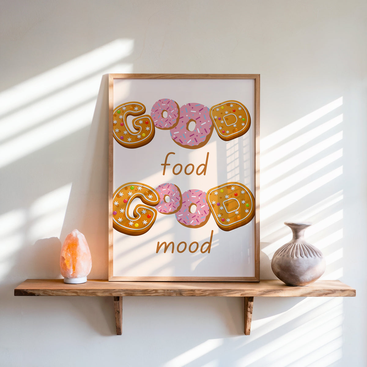 Good Food Good Mood donut print in an oak frame on a live-edge shelf beside a salt lamp