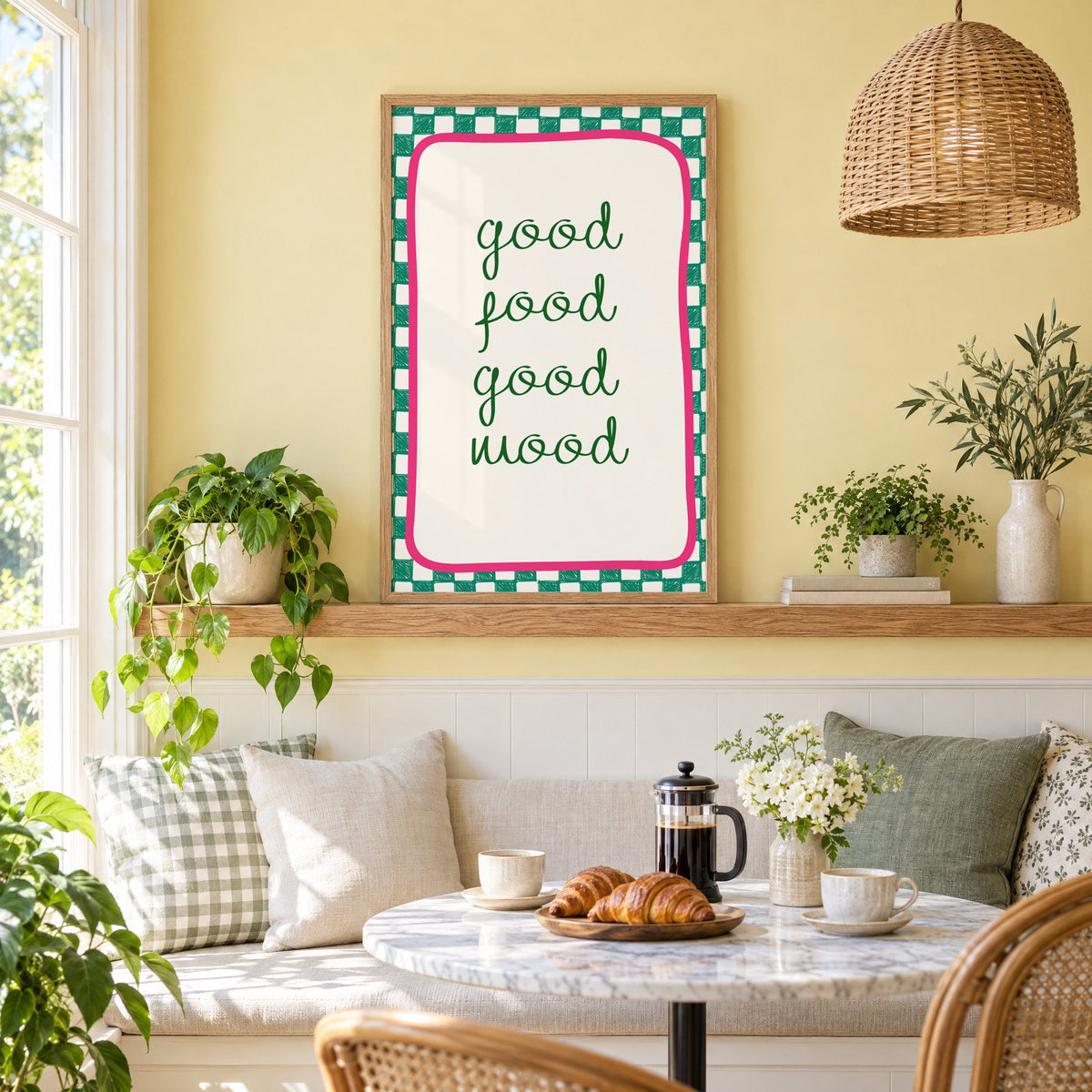 Good food good mood checkered print in an oak frame on a picture ledge above a sunny breakfast nook